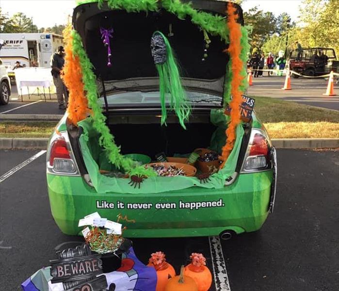 Halloween style decorated SERVPRO car at trunk or treat event