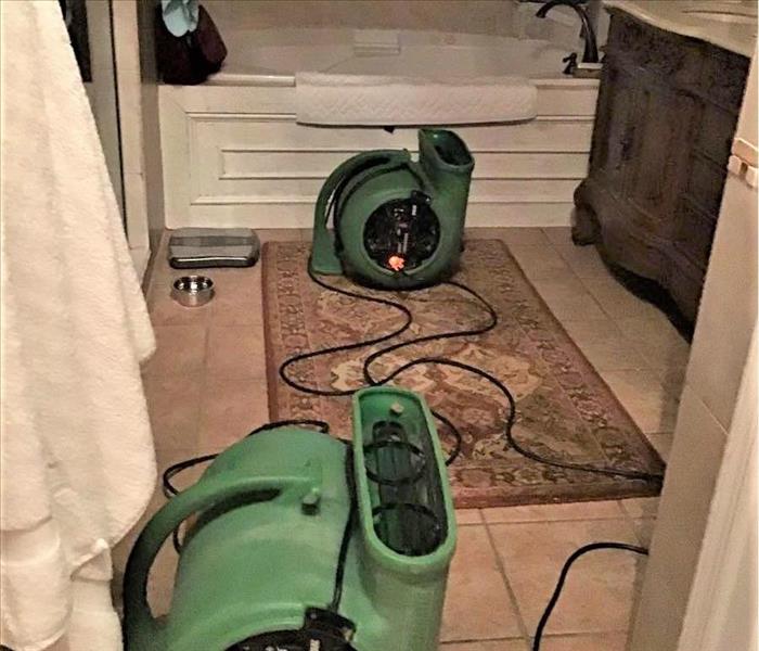 residential bathroom with SERVPRO drying equipment